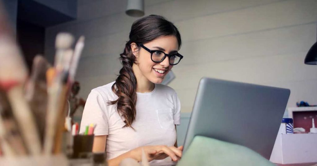 Photo of Woman Using Her Laptop