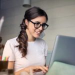 Photo of Woman Using Her Laptop