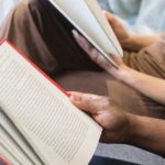 Man Reading Book Beside Woman Reading Book