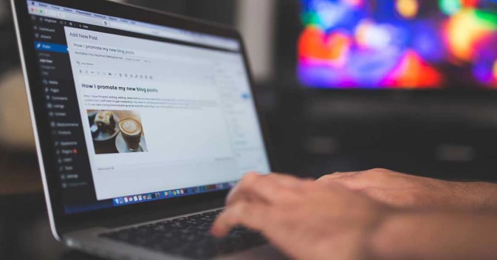 Person Holding Turned-on Silver Laptop Computer