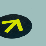 Yellow arrow on blue floor for directional guide