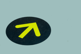 Yellow arrow on blue floor for directional guide