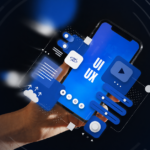 Hand holding a smartphone displaying blue UI and UX interface elements, surrounded by floating digital design components on a dark background.