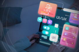 Person using a laptop with colorful digital UI/UX interface elements, such as music, video, settings, and user profiles, displayed over the screen, representing digital design and user experience concepts.